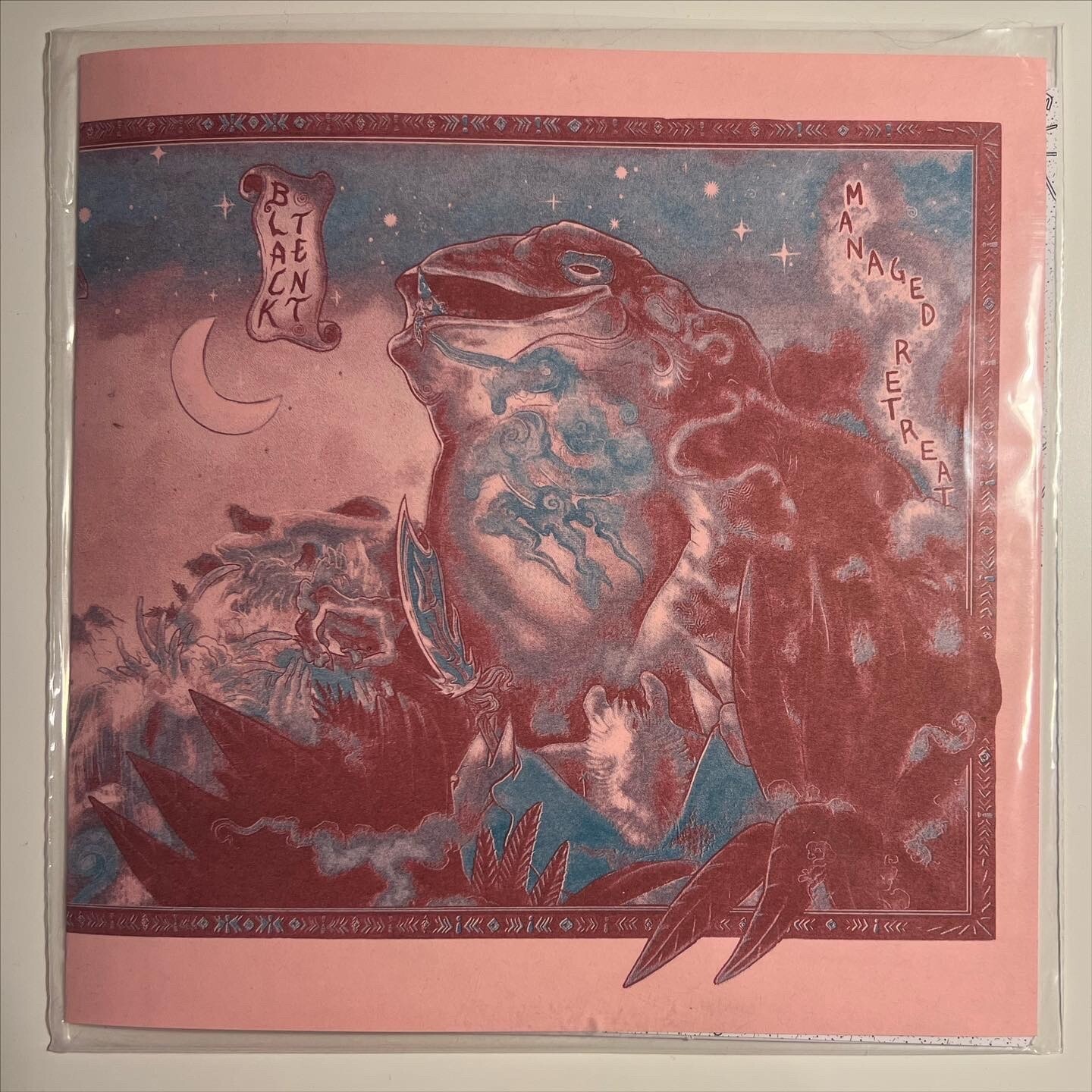 front cover artwork for Black Tent - Managed Retreat 10&quot;. maroon image of a giant frog tower with a wizard peering out of the mouth, and a crab carrying a glaive. the background is pink paper and the print is in two colors - burgundy and blue